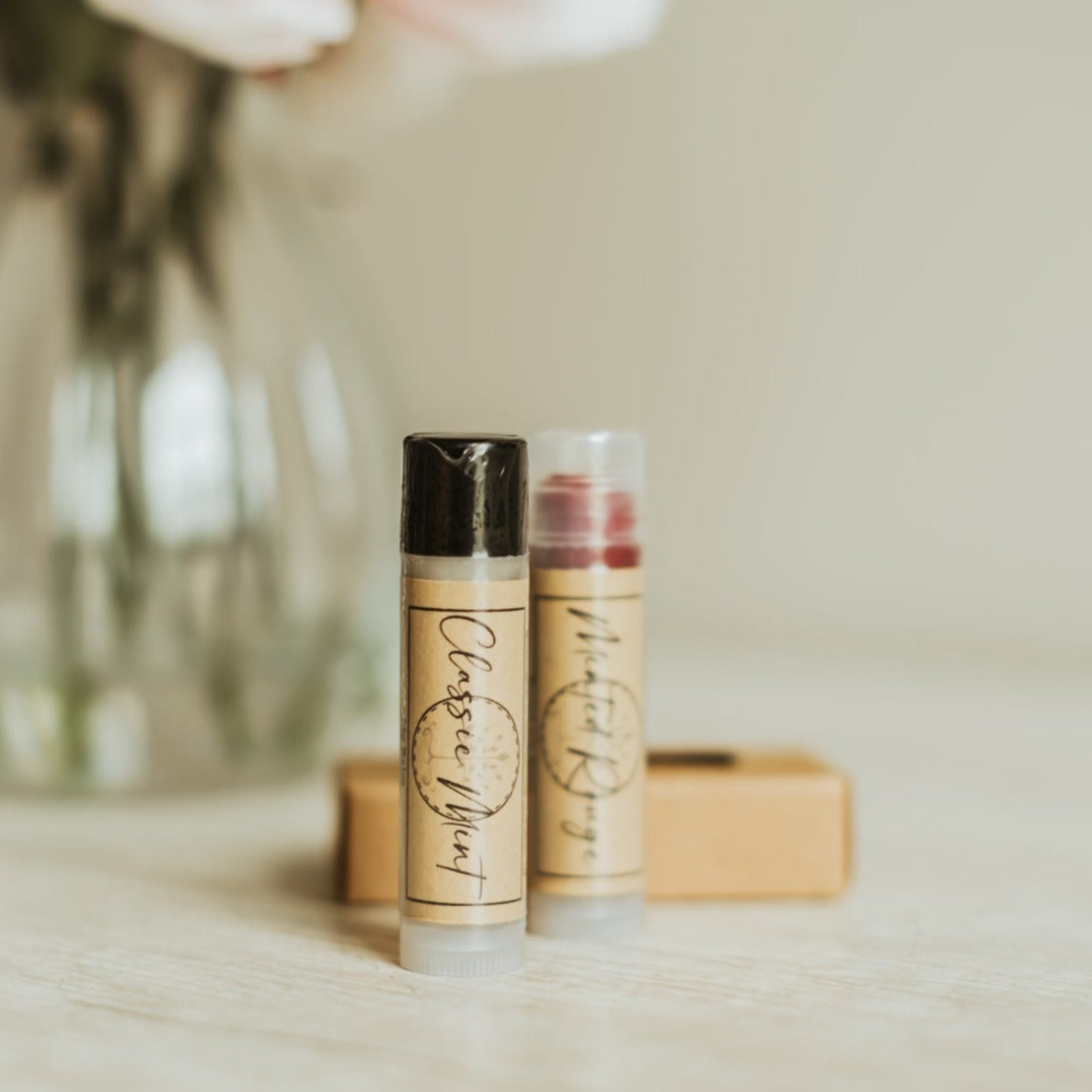 Handcrafted natural lip balm tubes in classic and seasonal flavors