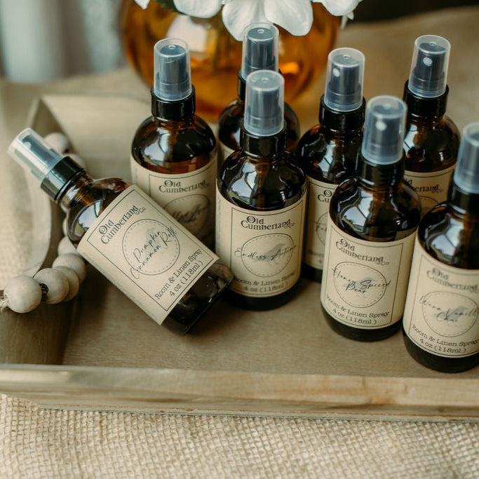 Collection of Old Cumberland Co products on a wooden tray with a blurred background